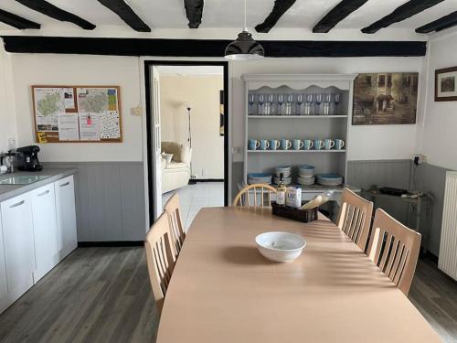 a kitchen with a table with a bowl on it at Lovely French Farmhouse with Private Swimming Pool in Bourganeuf