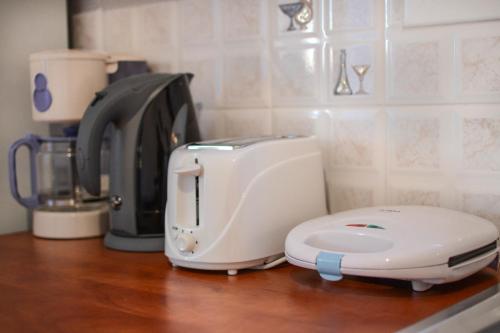 a white mixer sitting on top of a counter at Villa Silvia by Andrian Villas in Kalamítsion Alexándrou