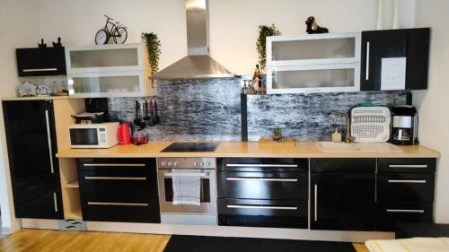 a kitchen with a sink and a stove top oven at Lalina in Liezen