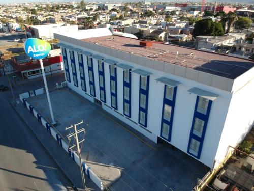 an aerial view of a building with a aloha sign on it at Hotel ALO! Express in Torre&oacute;n