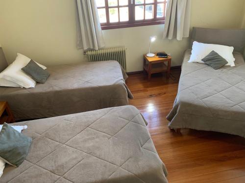 Postel nebo postele na pokoji v ubytování Altos da Serra Hotel