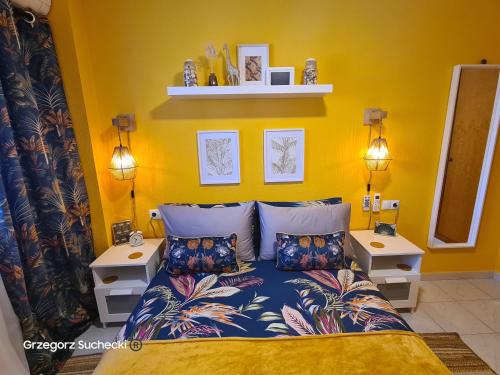 a bedroom with a bed and two night stands at Apartamento Parquemar in La Mata
