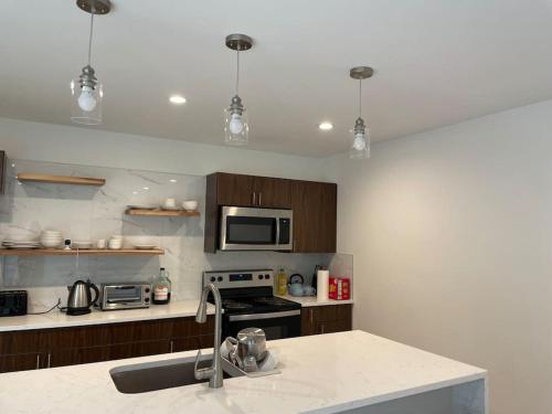 a kitchen with a sink and a stove top oven at Lake home on 3 acres in Mabank