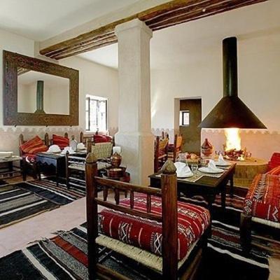a living room with a couch and a table at Dar Sihamou in Tabant