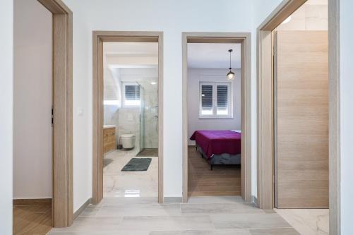 a hallway with two doors leading to a bedroom at Residence Bella Vista in Bibinje