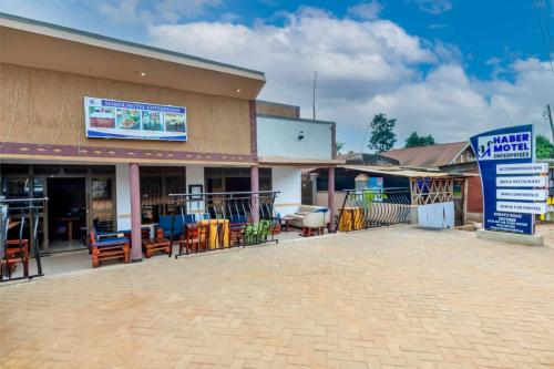 a building with a sign in front of it at Haber Motel Enterprise Ltd in Entebbe