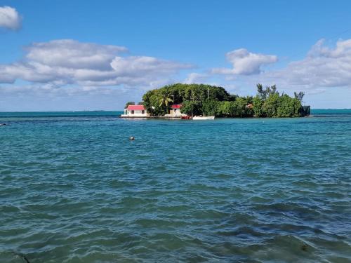 a small island in the middle of the water at Le Manguier in Mahébourg