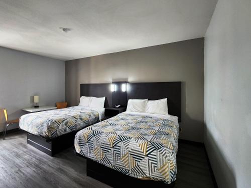 Кровать или кровати в номере Motel 6-Pine Bluff, AR