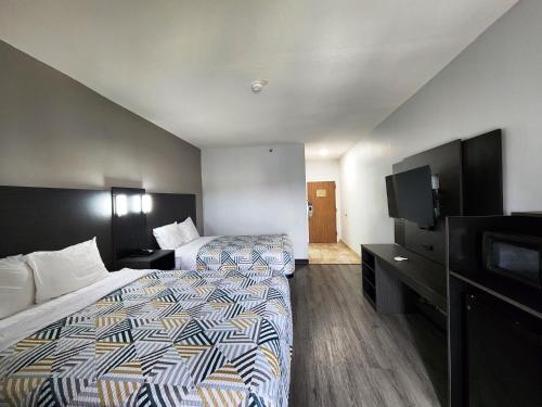 Кровать или кровати в номере Motel 6-Pine Bluff, AR
