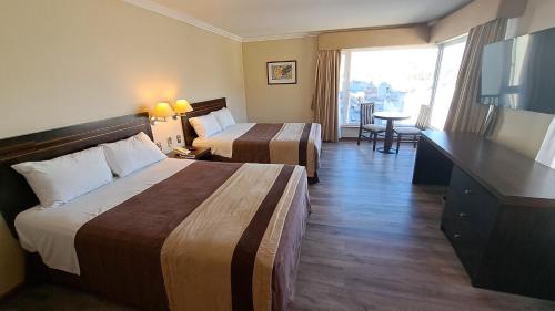 Postel nebo postele na pokoji v ubytování Hotel Diego de Almagro Valparaíso
