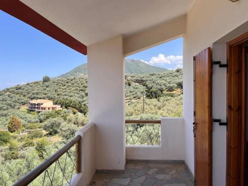 a balcony with a view of a mountain at Tranquility Mountain & Sea View Koudoura House in Trápeza