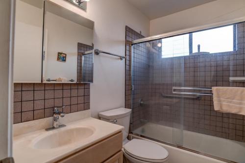 a bathroom with a sink and a toilet and a shower at Hono Kai B15 in Maalaea