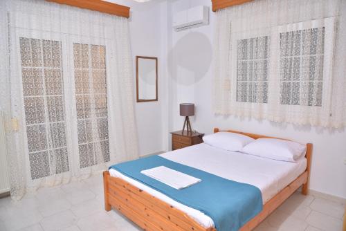 Postel nebo postele na pokoji v ubytování ZeusPlace Konaki House Leptokarya