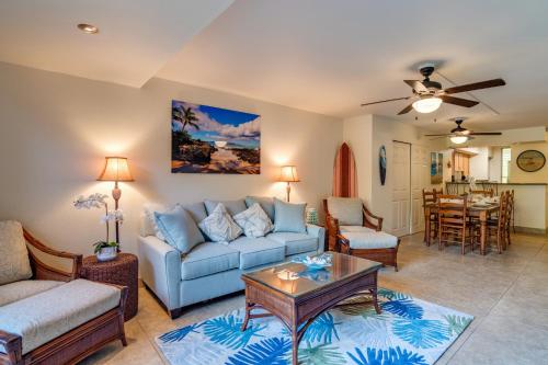 a living room with a couch and a table at Kahana Villa E111 in Kahana