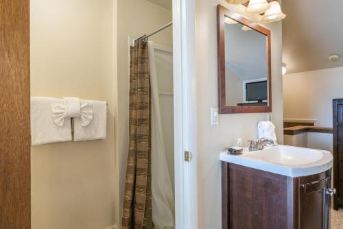 a bathroom with a sink and a mirror at Powder Point Condos by Lespri Property Management in Park City