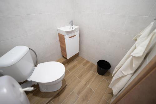 a bathroom with a white toilet and a sink at Rekreačné zariadenie Oliva - Patince in Patince