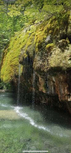 a waterfall on the side of a rock in a river at Ferienwohnung am Pferdemarkt in Konz