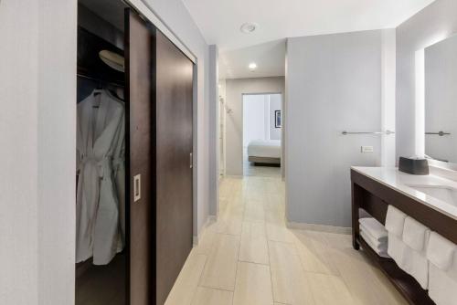 a bathroom with a sink and a mirror at Hyatt Place West Palm Beach in West Palm Beach