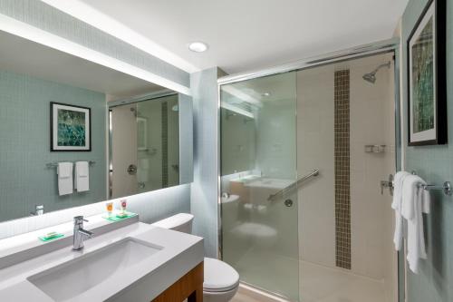 a bathroom with a shower and a sink and a toilet at Hyatt Place San Jose Airport in San Jose