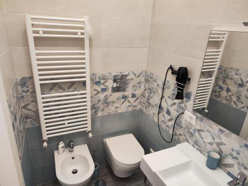 a bathroom with a toilet and a sink at B&B Il Regno delle Due Sicilie in Naples