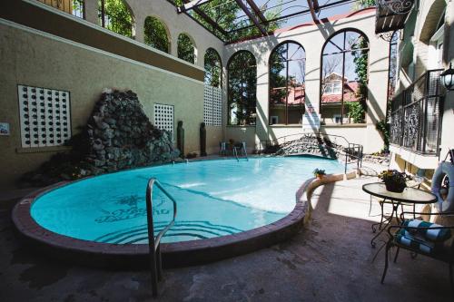 a large swimming pool in a building at The Hotel Paisano in Marfa