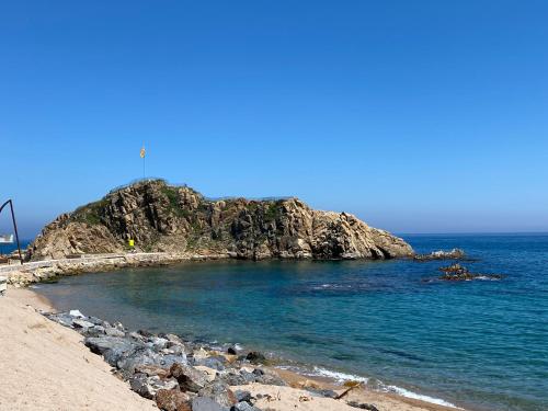 a small island in the middle of the ocean at El Rancho at the Beach in Blanes