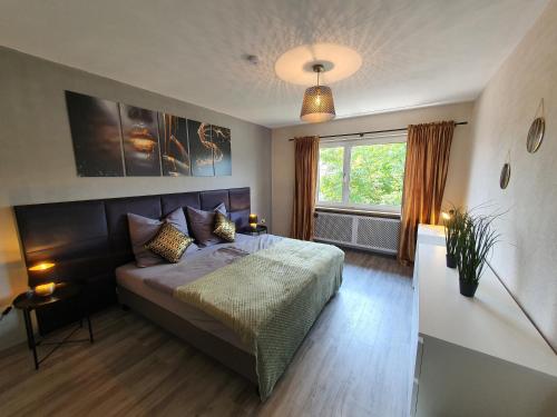 Postel nebo postele na pokoji v ubytování ☆ Like @ home *☆ moderne Wohnung in Oberottmarshausen ☆ Netflix