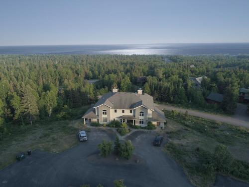 an aerial view of a large house with a driveway at MyLutsen in Lutsen