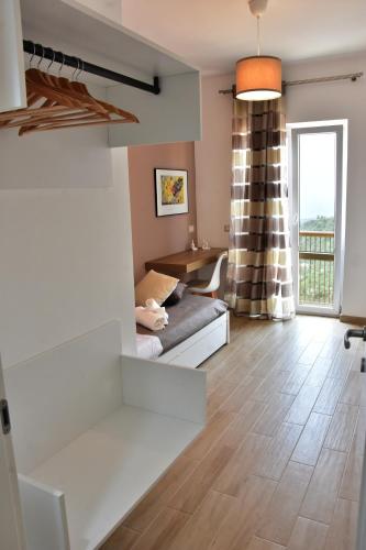 a living room with a couch and a table at Tao enJoy Suite in Taormina