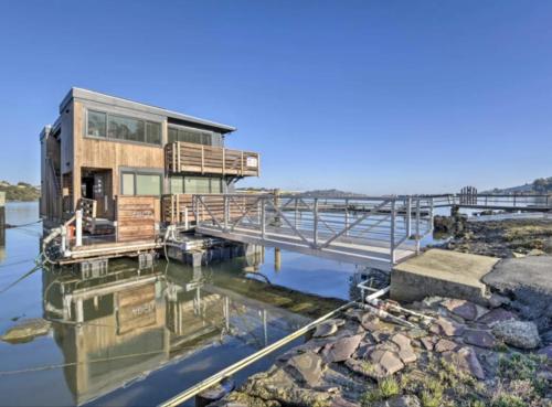 a house on a dock in the water at Floating Condos of Commodore 11 in Mill Valley