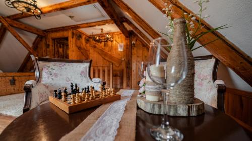 a chess board and a vase on a table at KUĆA ZA ODMOR DANICA in Čabar