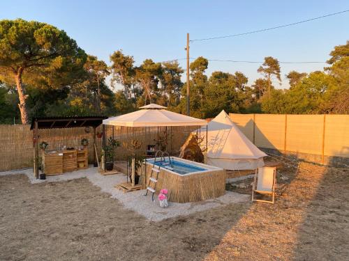 a tent and a swimming pool in a yard at Estera Tent Camping in Zadar