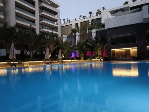 a large swimming pool in front of a building at Sheraton Ocean 601-B - Private apartments in Cairo