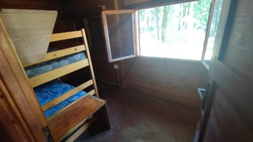 a small room with a bunk bed and a window at Soukeník FCT in Sezimovo Ústí