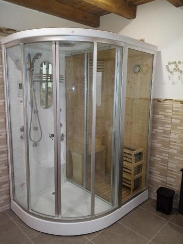 a shower with a glass enclosure in a bathroom at Palazzo Vassallo3 in Pieve di Teco
