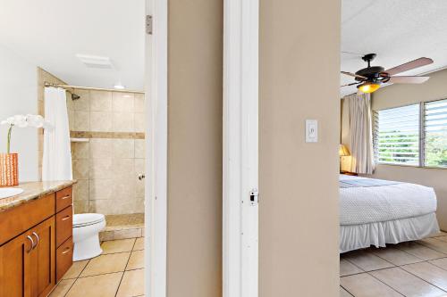 a bathroom with a toilet sink and a shower at Kihei Kai Nani 368 in Kihei