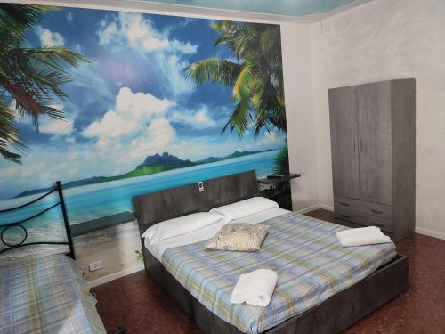 a bedroom with a painting of the ocean at Casa vacanza Orio al Serio Bergamo in Orio al Serio