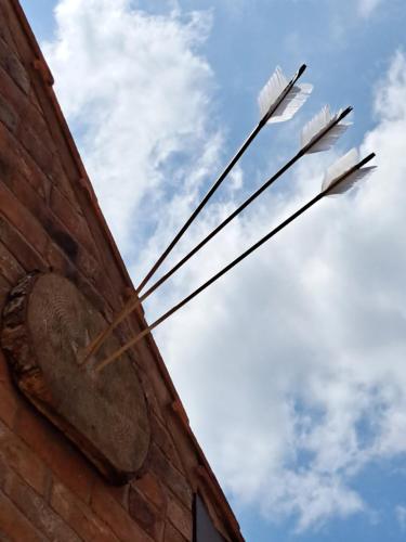 a sign on the side of a brick building at Willow's Cottage in Edwinstowe