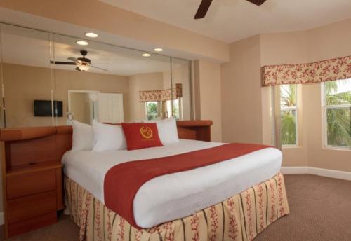 a large bedroom with a large bed and a window at One bedroom deluxe villa in Orlando