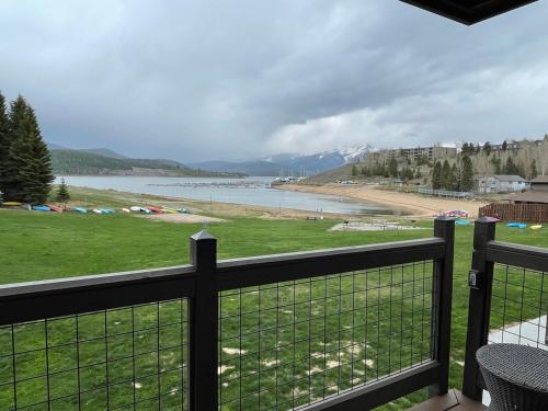 a balcony with a view of a beach and water at Lakefront Luxury Condo with Stunning Views!! in Dillon