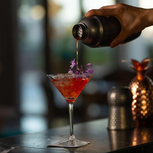 a drink being poured into a martini glass at Radisson Blu Resort Al Hoceima in Al Hoceïma