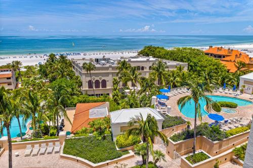 an aerial view of a resort with a pool and a beach at Seashells and Sunshine Marco Beach Ocean Resort 1105 in Marco Island