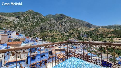 a view of the mountains from the balcony of a building at Casa Meftah Blue in Chefchaouene