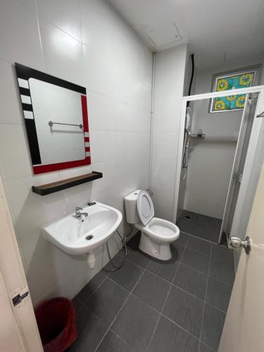 a bathroom with a toilet and a sink and a shower at Home Away From Home In Taiping - Newly Upgraded! in Taiping