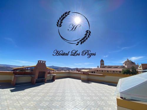 a view from the roof of a building with the words hotel los reps at Hostal Los Pozos in Potosí