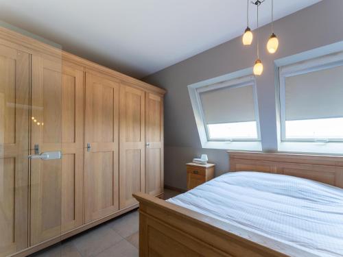 En eller flere senge i et værelse på Bright Coastal Stay in Bredene