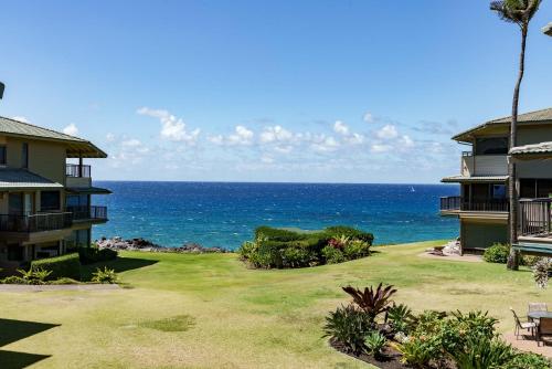 a view of the ocean from a resort yard at Kapalua Bay Villa 29B4 villa in Kahana