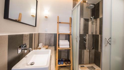 a bathroom with a sink and a shower at Yunshan Villa in Huangshan Scenic Area