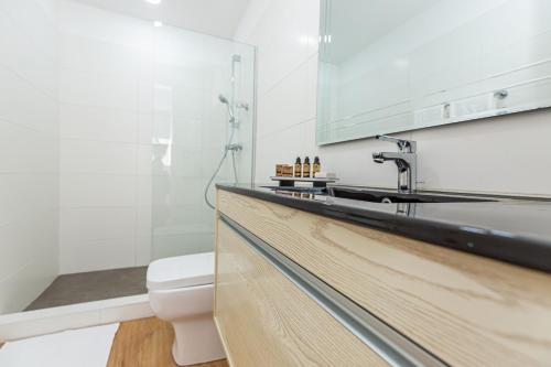 a bathroom with a sink and a toilet at Impressive City View Apartment A - PH Quartier Marbella in Panama City