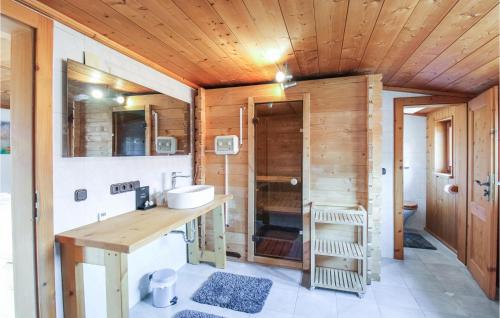 a bathroom with a sink and a wooden ceiling at Nice Apartment In Pfronten With Sauna, Wifi And 1 Bedrooms in Pfronten